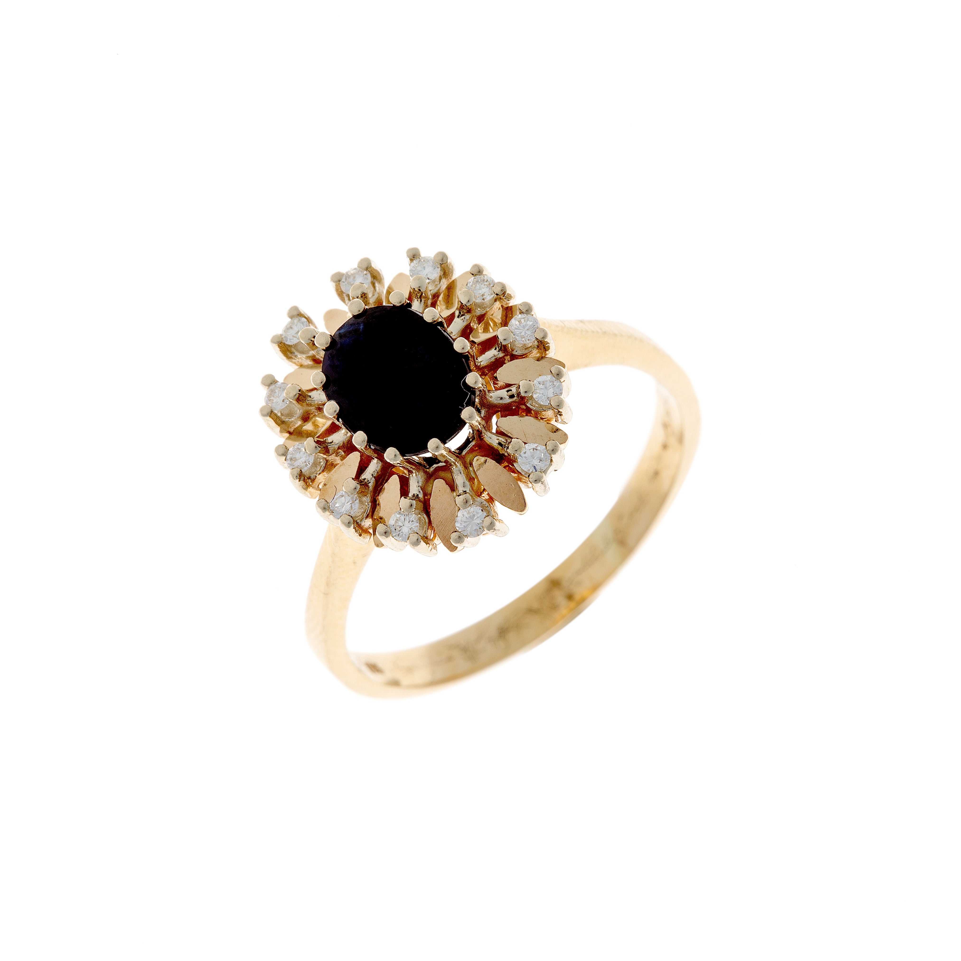 Angled view of a vintage sapphire and diamond cluster ring with 1960s floral-inspired design.
