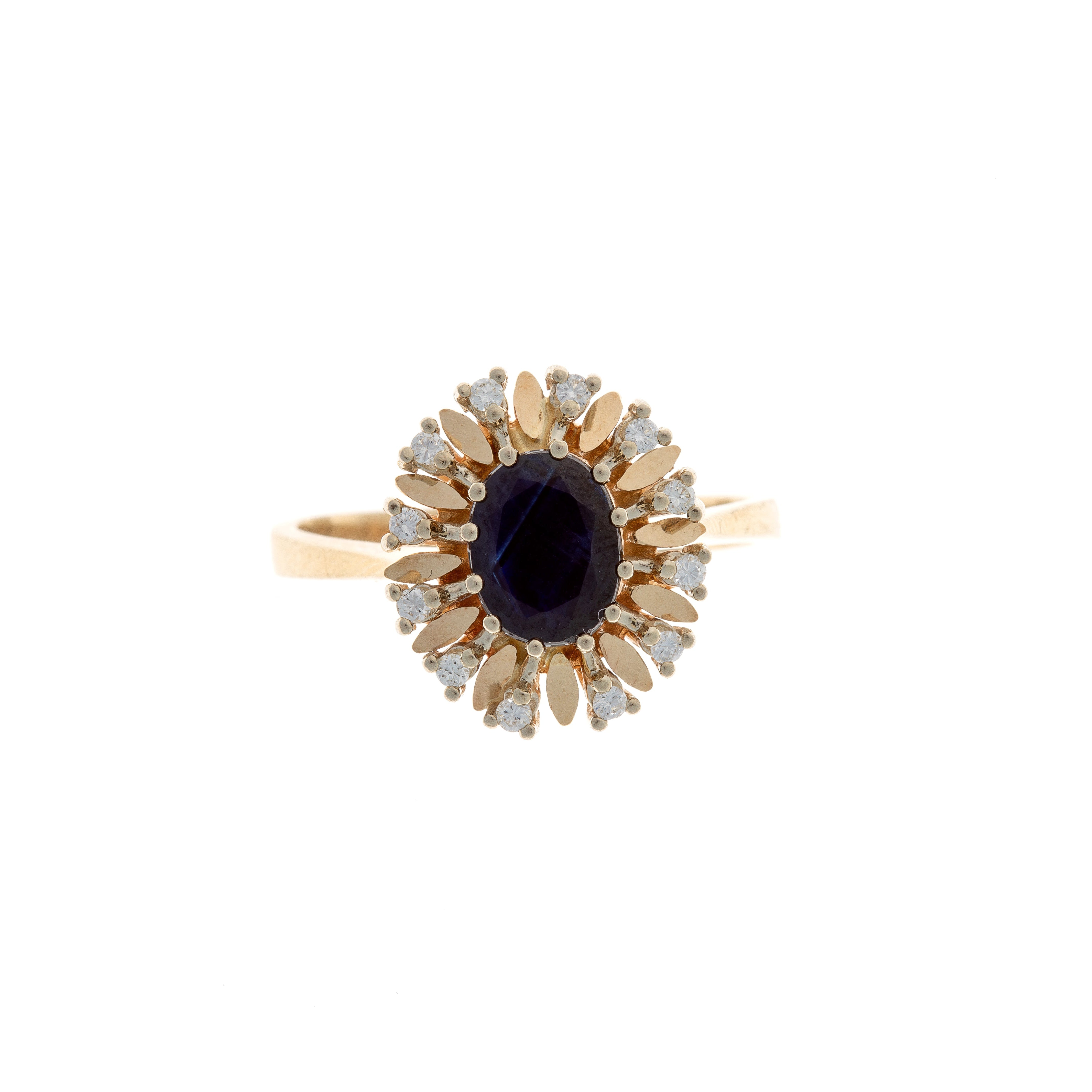 Mid-Century 14K gold ring featuring an oval sapphire surrounded by a brilliant-cut diamond halo.