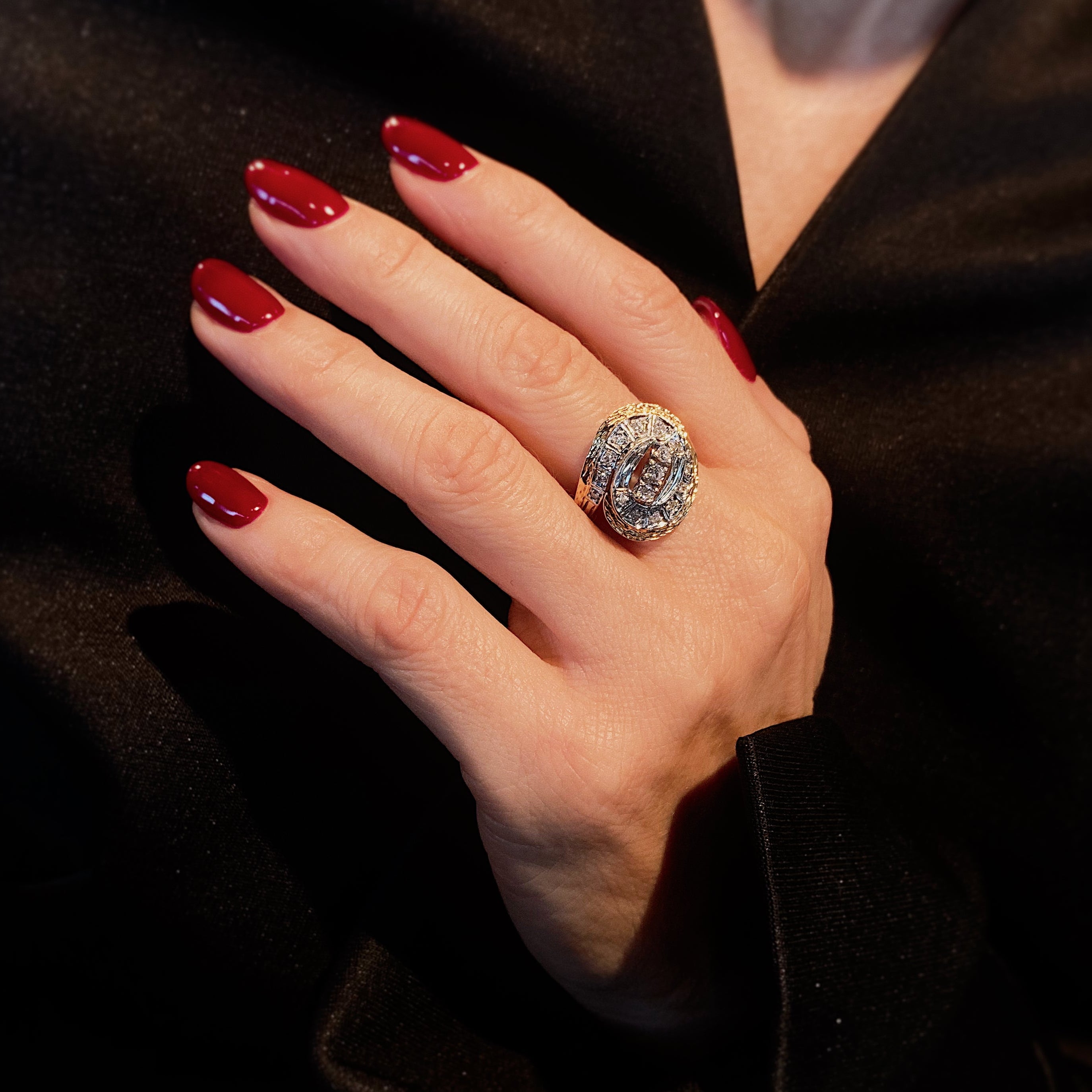 Woman wearing the Retro two-tone gold textured diamond swirl cocktail ring.