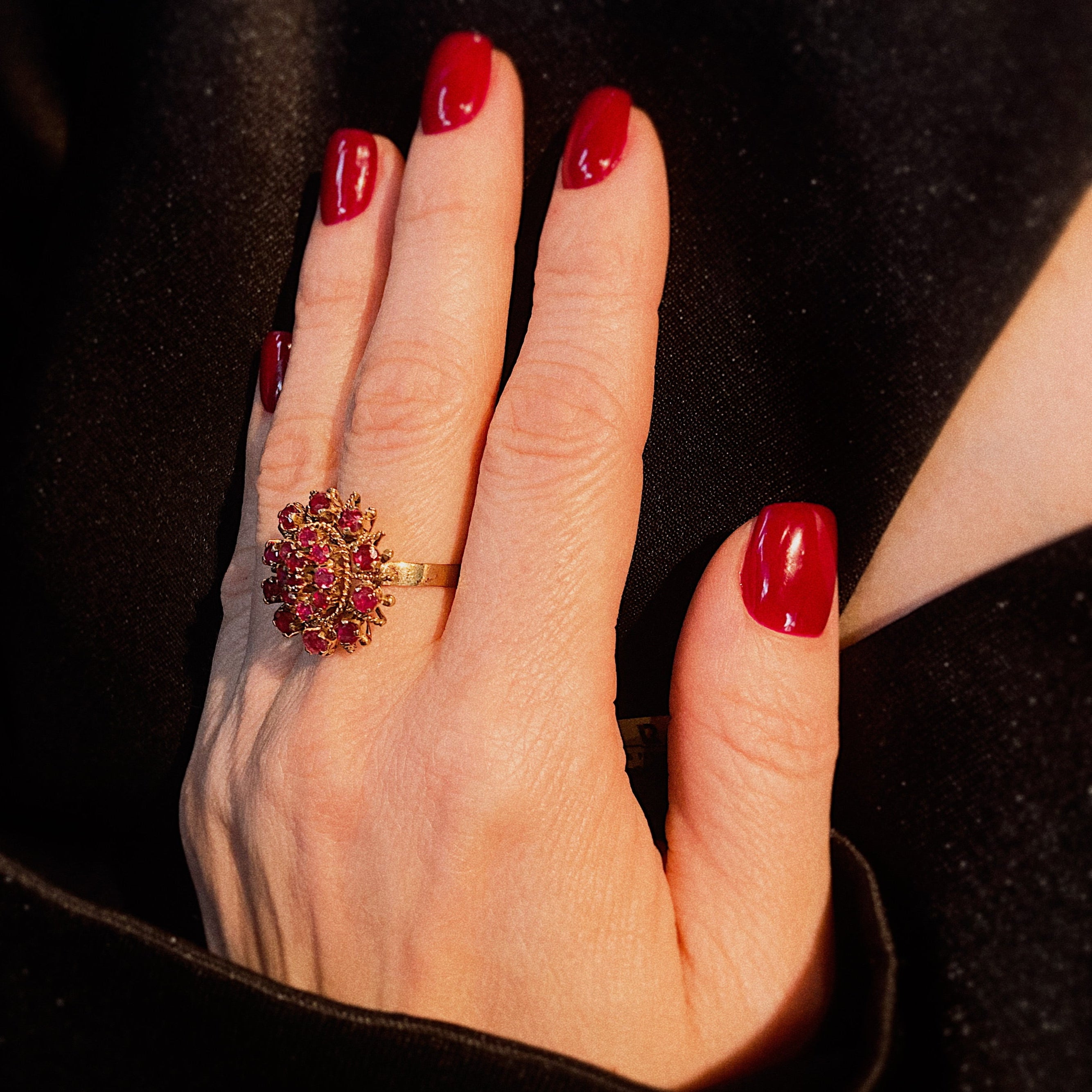 Model wearing the vintage gold ruby cluster crown cocktail ring.
