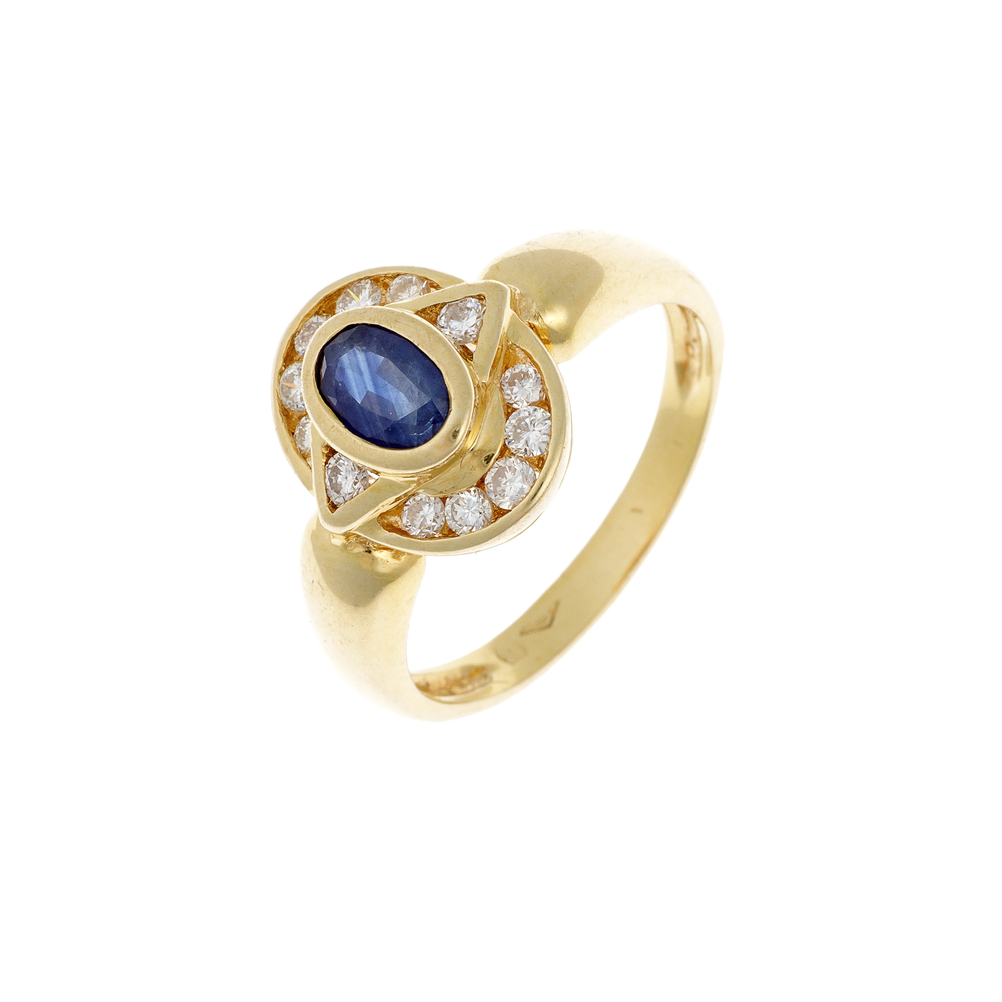 Angled view of sapphire gold ring showing diamond halo setting.