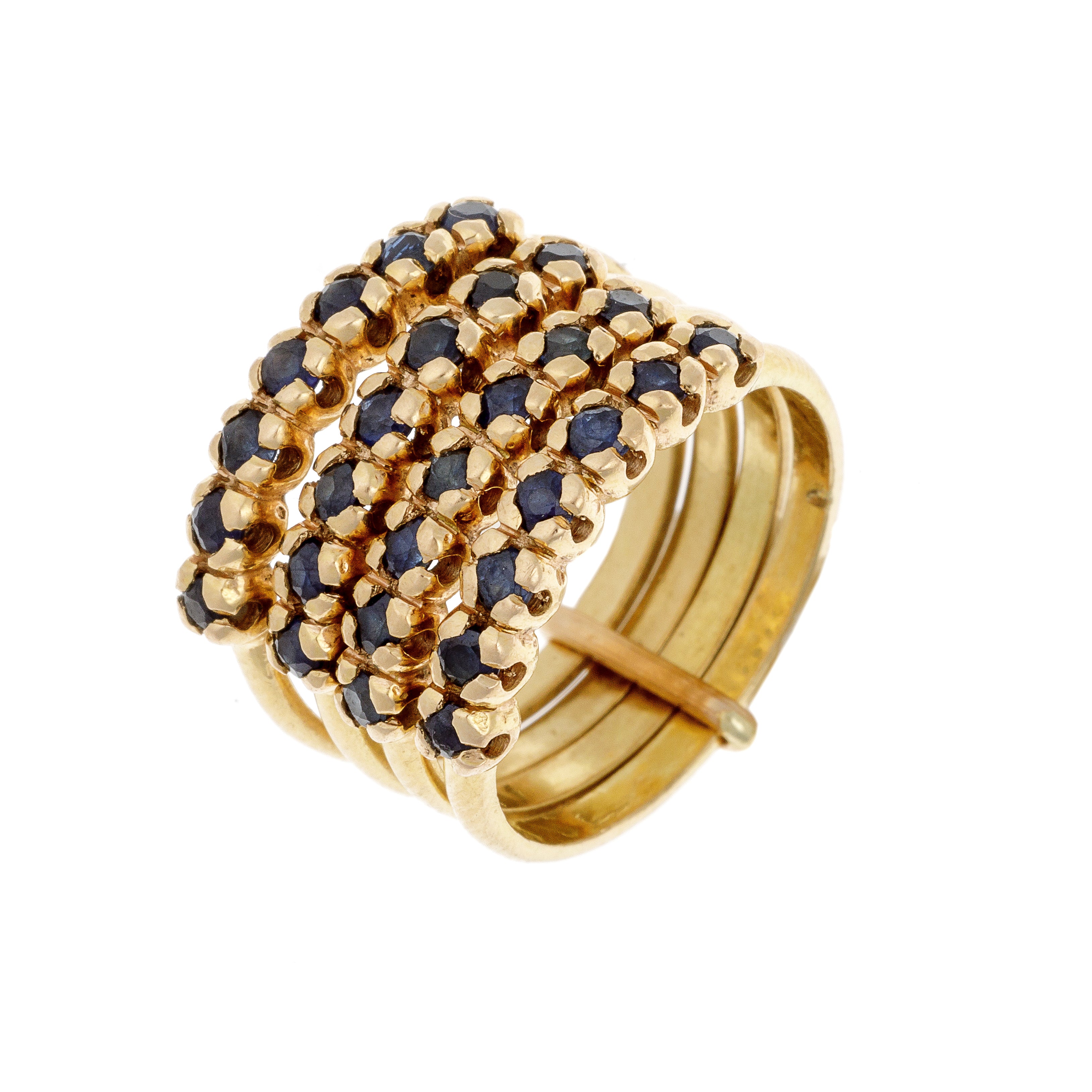 Angled view of wide-band sapphire ring showcasing its layered rows and high-polish gold finish.
