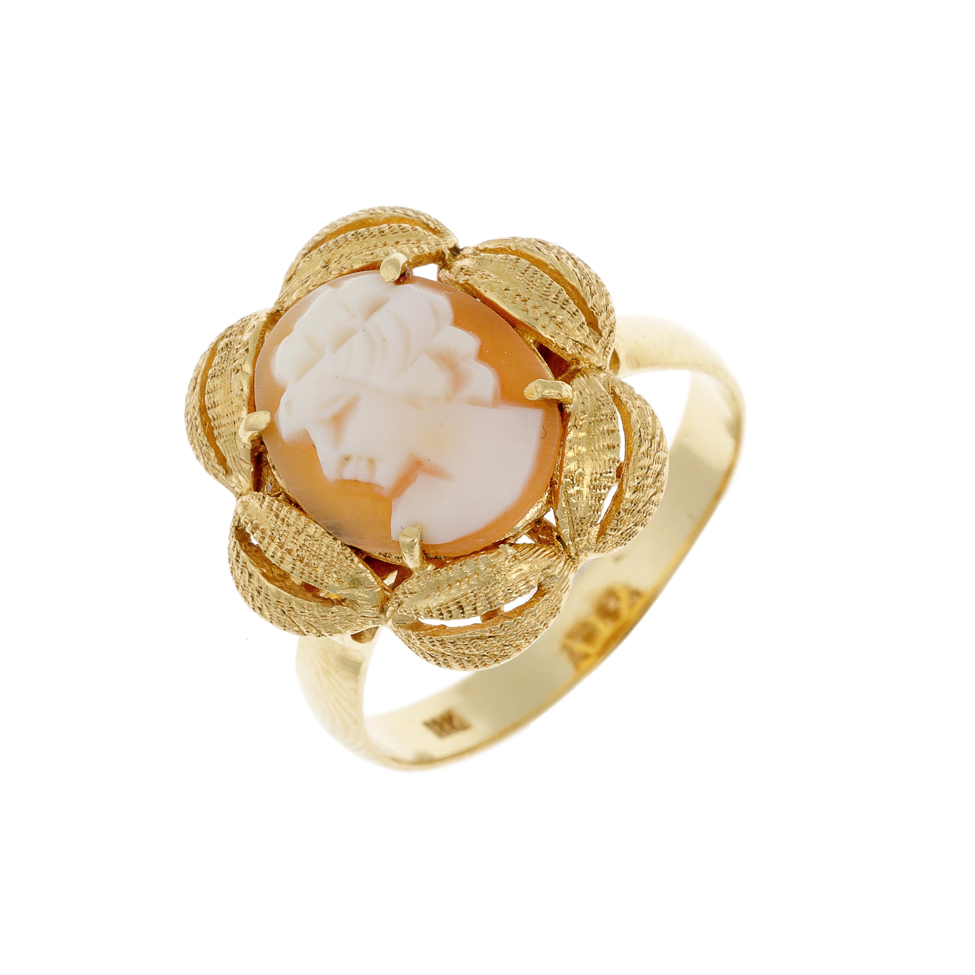 Angled view of vintage shell cameo gold ring showing raised setting and rope detailing.