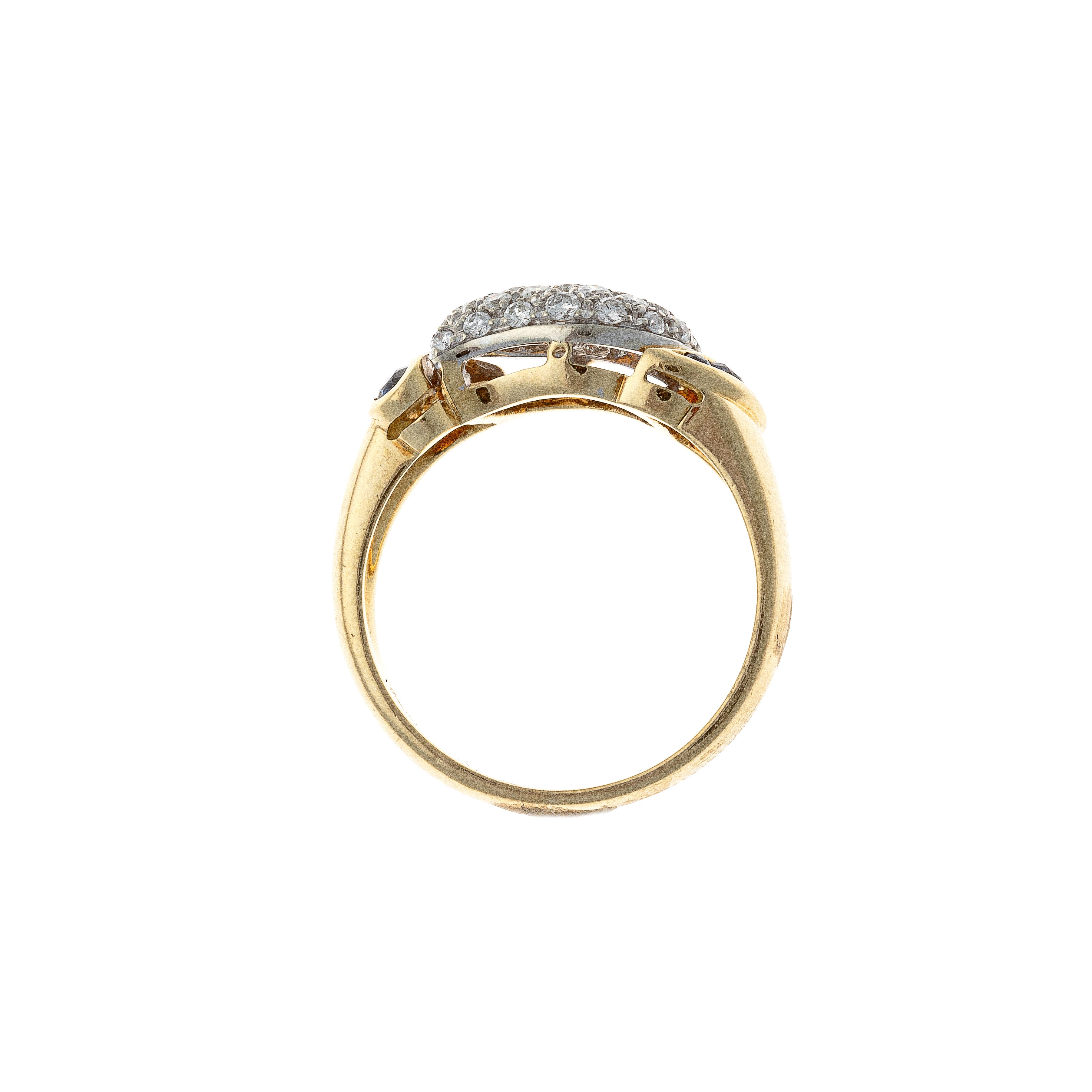 Profile of the vintage two-tone gold diamond and sapphire domed cocktail ring.