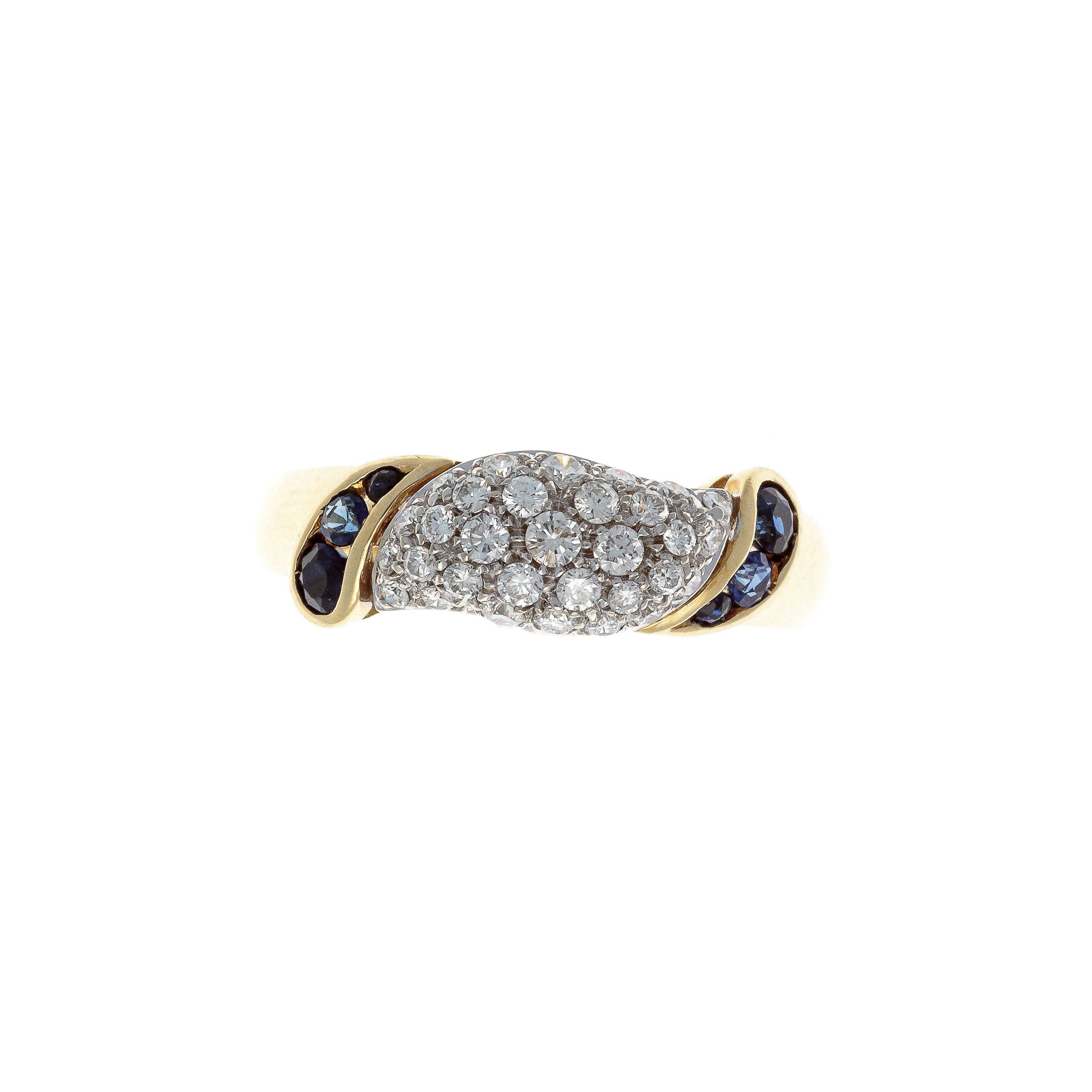 Top of the vintage two-tone gold diamond and sapphire domed cocktail ring.