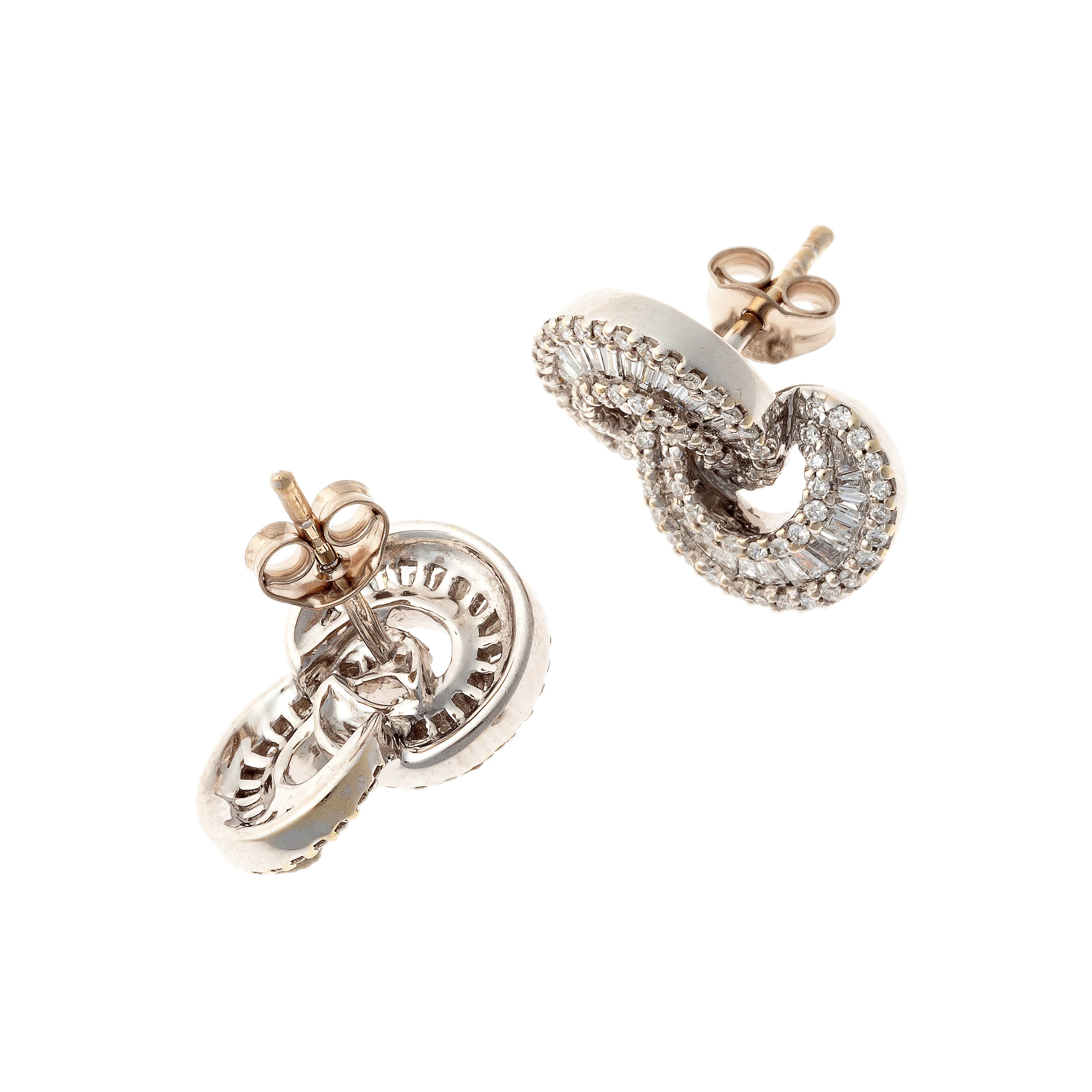 Backs of vintage white gold earrings with baguette and round diamonds.