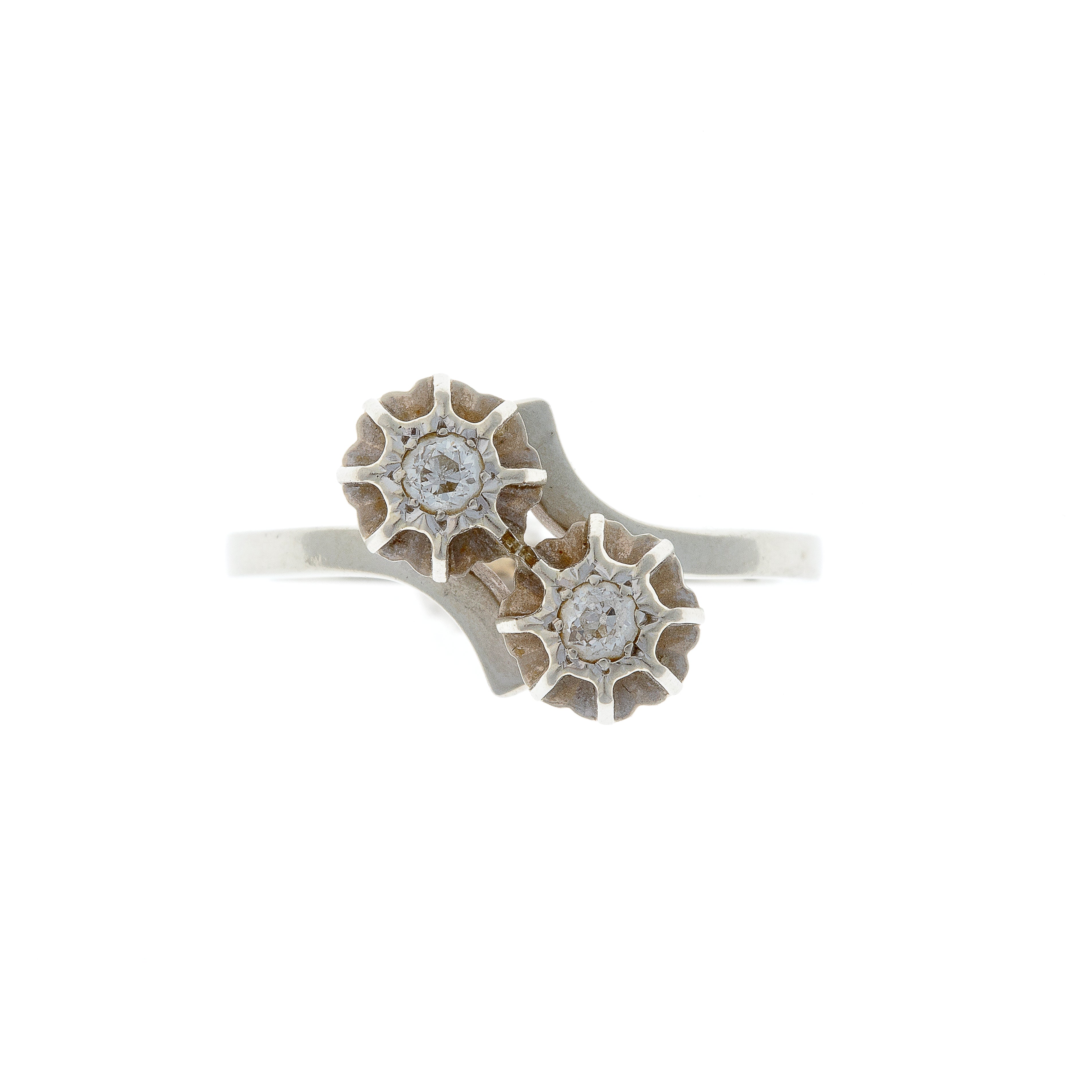 Front view of contemporary vintage white gold toi et moi ring with twin diamonds in minimalist setting.