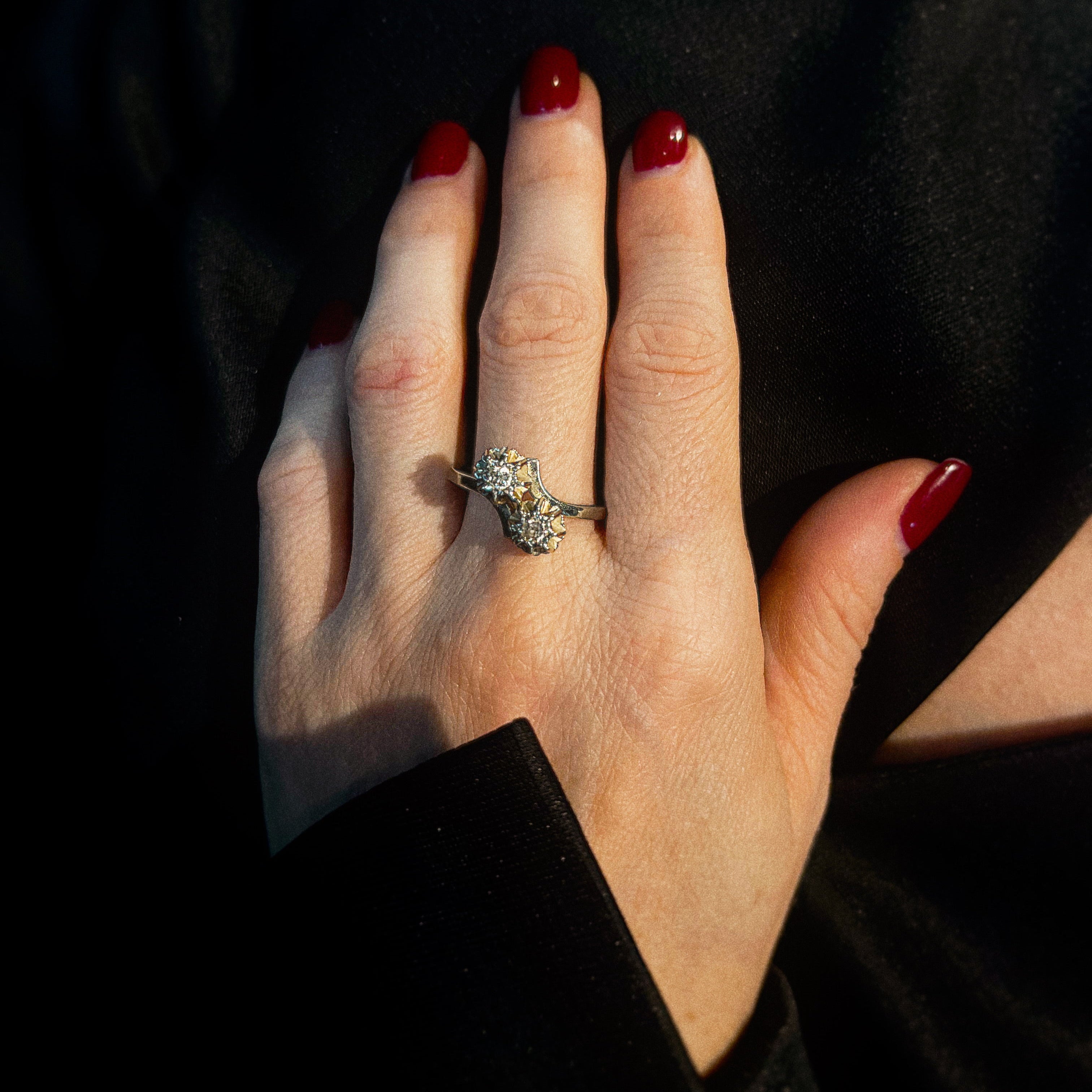 Model wearing the vintage white gold diamond Toi et Moi engagement ring.