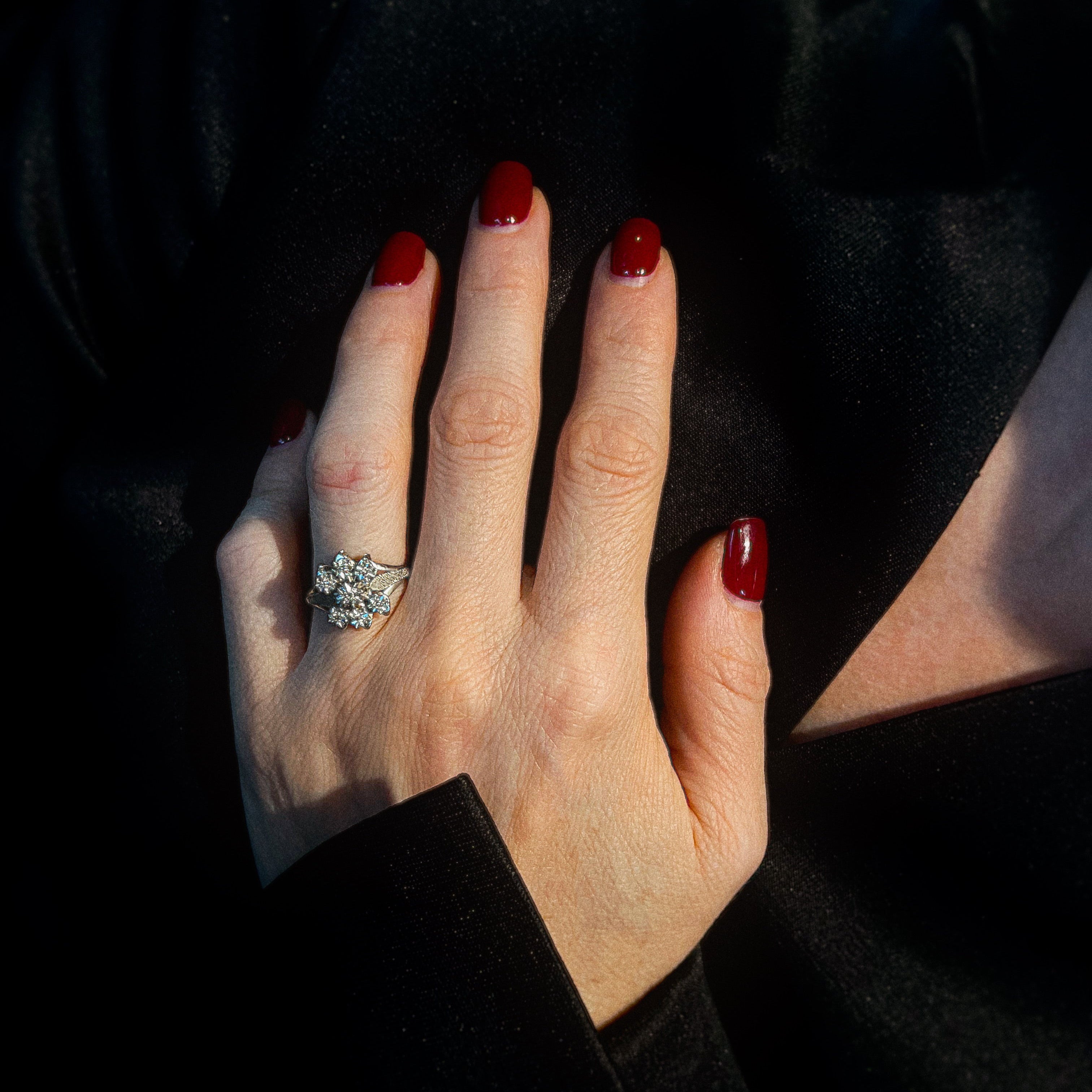 Model wearing the vintage white gold floral diamond cluster cocktail ring.