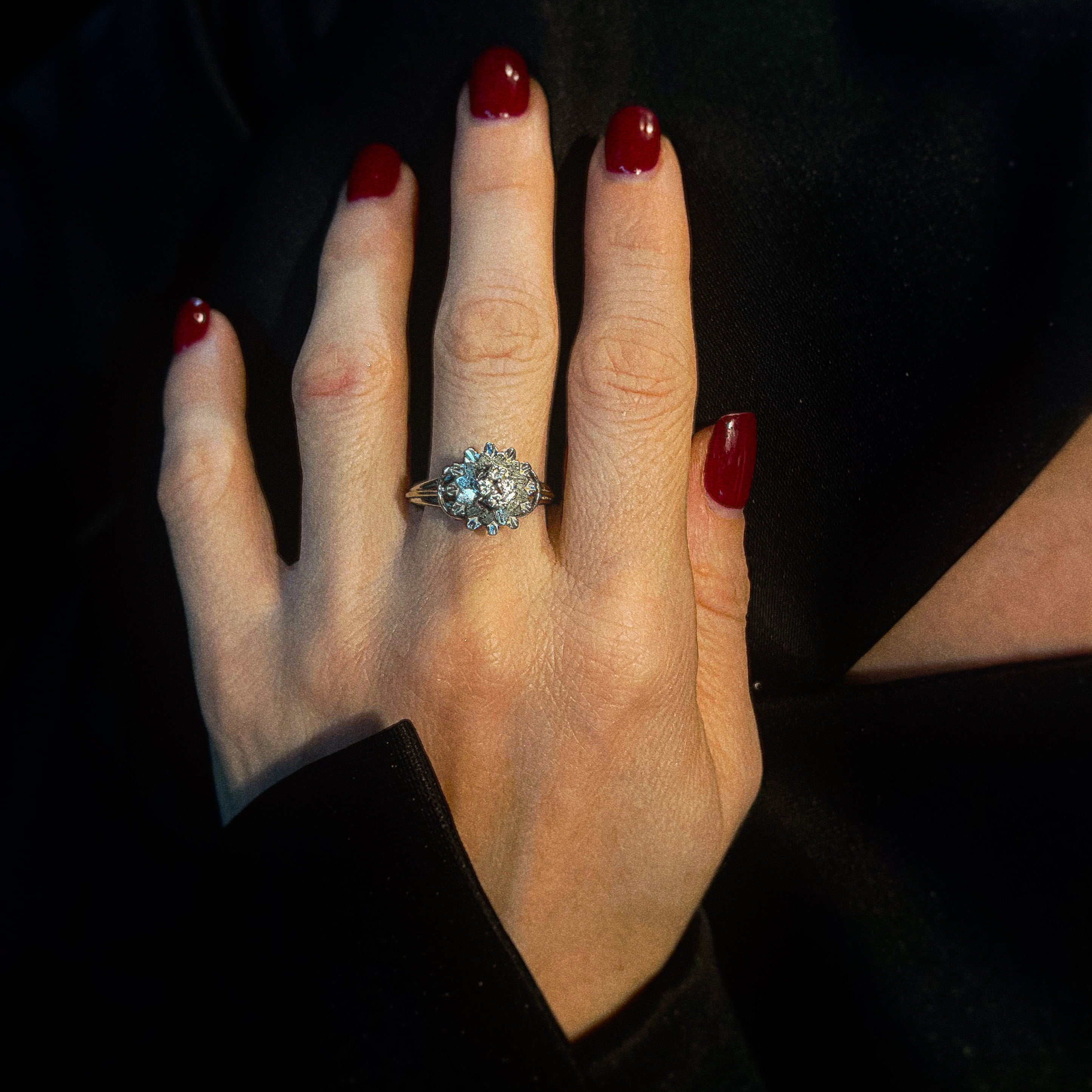 Model wearing the vintage white gold floral cocktail ring with cubic zirconia.
