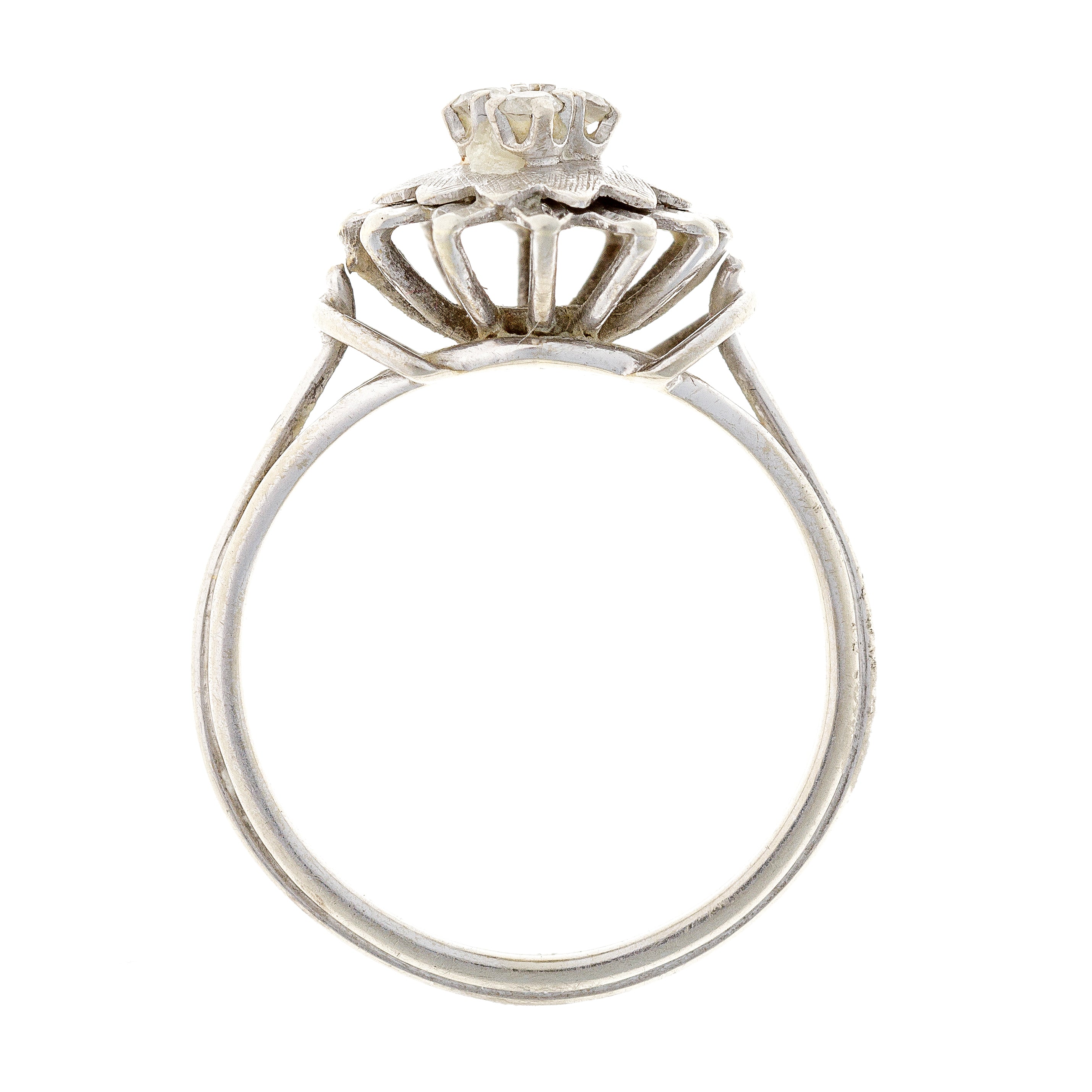 Profile view of the vintage floral ring, emphasizing the structured gold setting and sparkling cubic zirconia centerpiece.