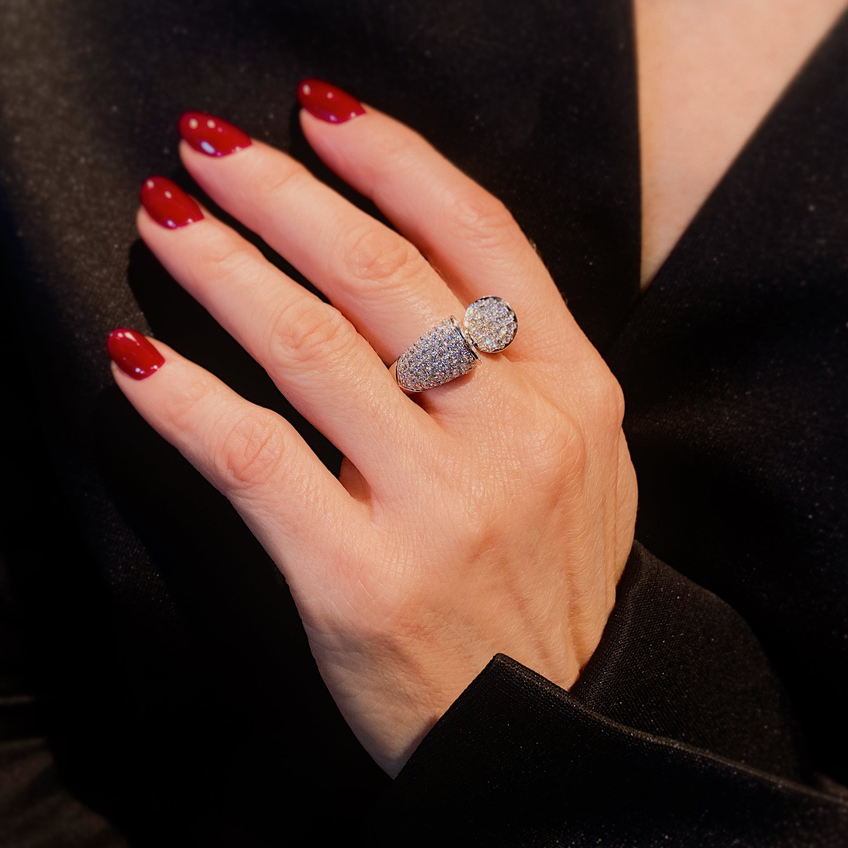 Woman wearing the contemporary vintage white gold pavé diamond bypass cocktail ring.