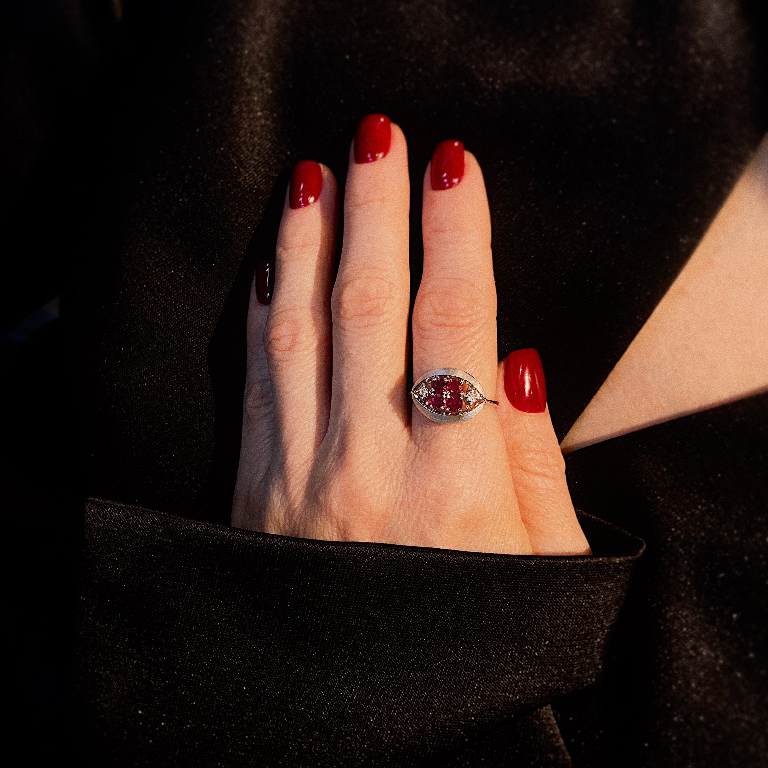 Model wearing the 1980s vintage white gold ruby and diamond cocktail ring.