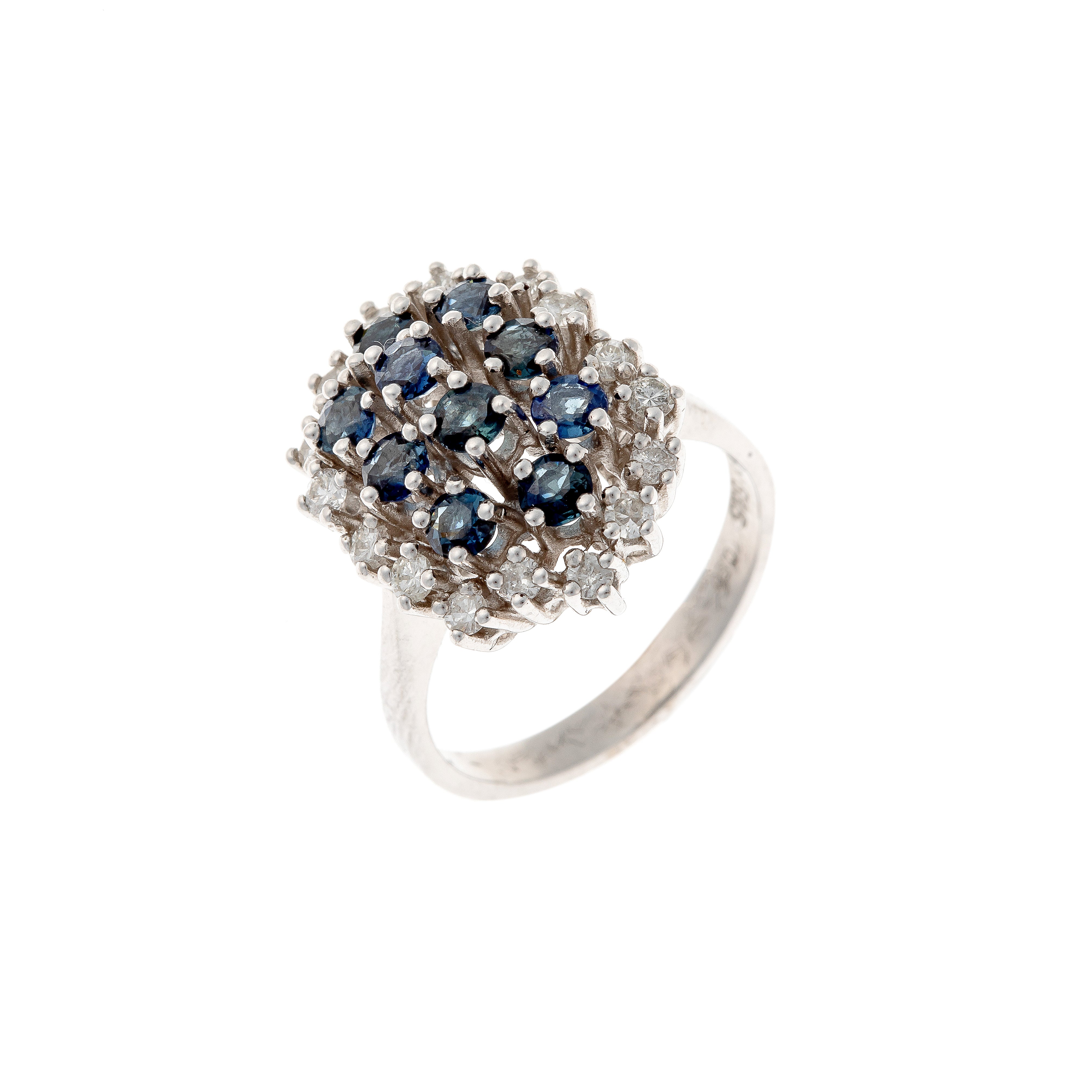 Contemporary vintage white gold cluster cocktail ring with blue sapphires and diamonds.