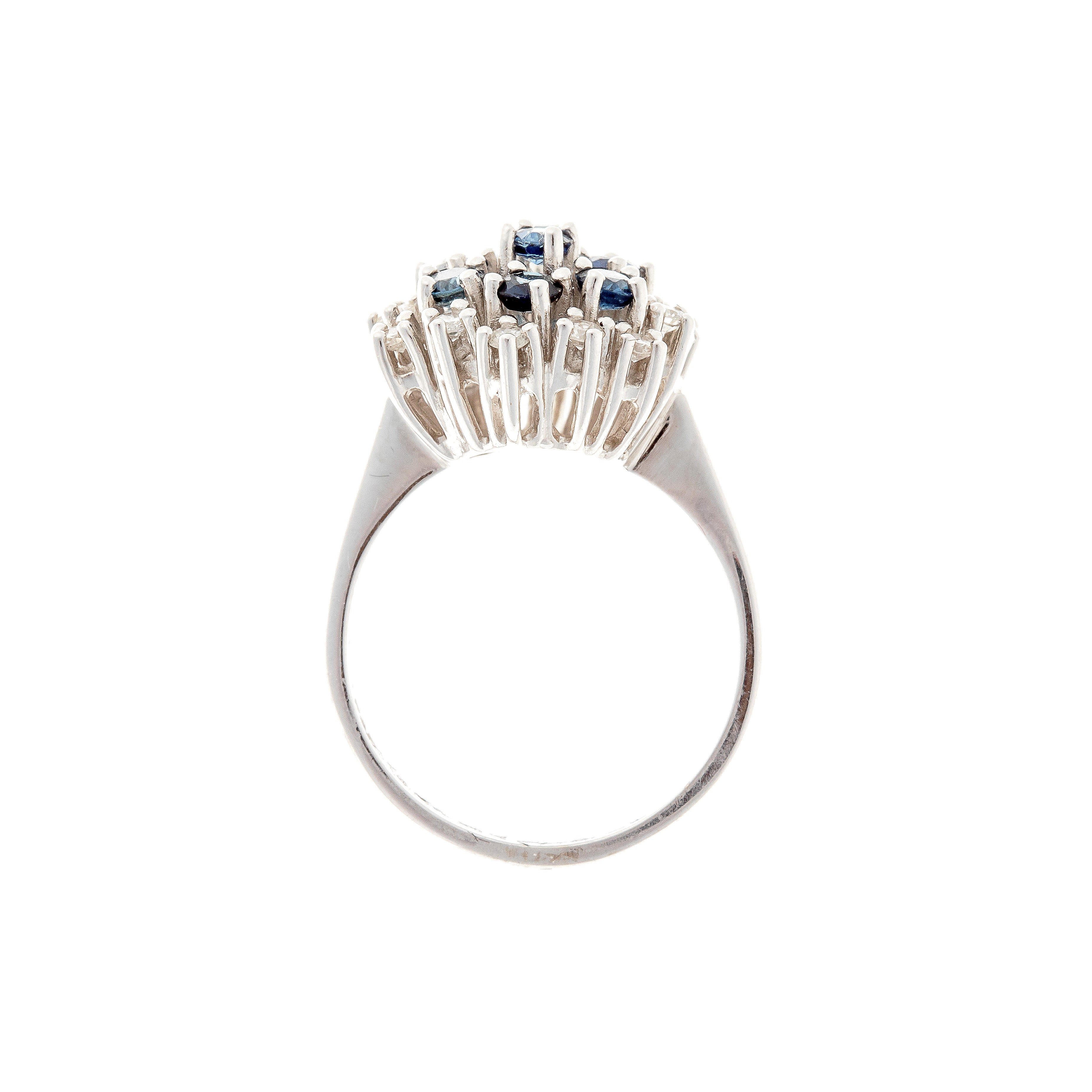 Profile of the contemporary vintage white gold cluster cocktail ring with blue sapphires and diamonds.