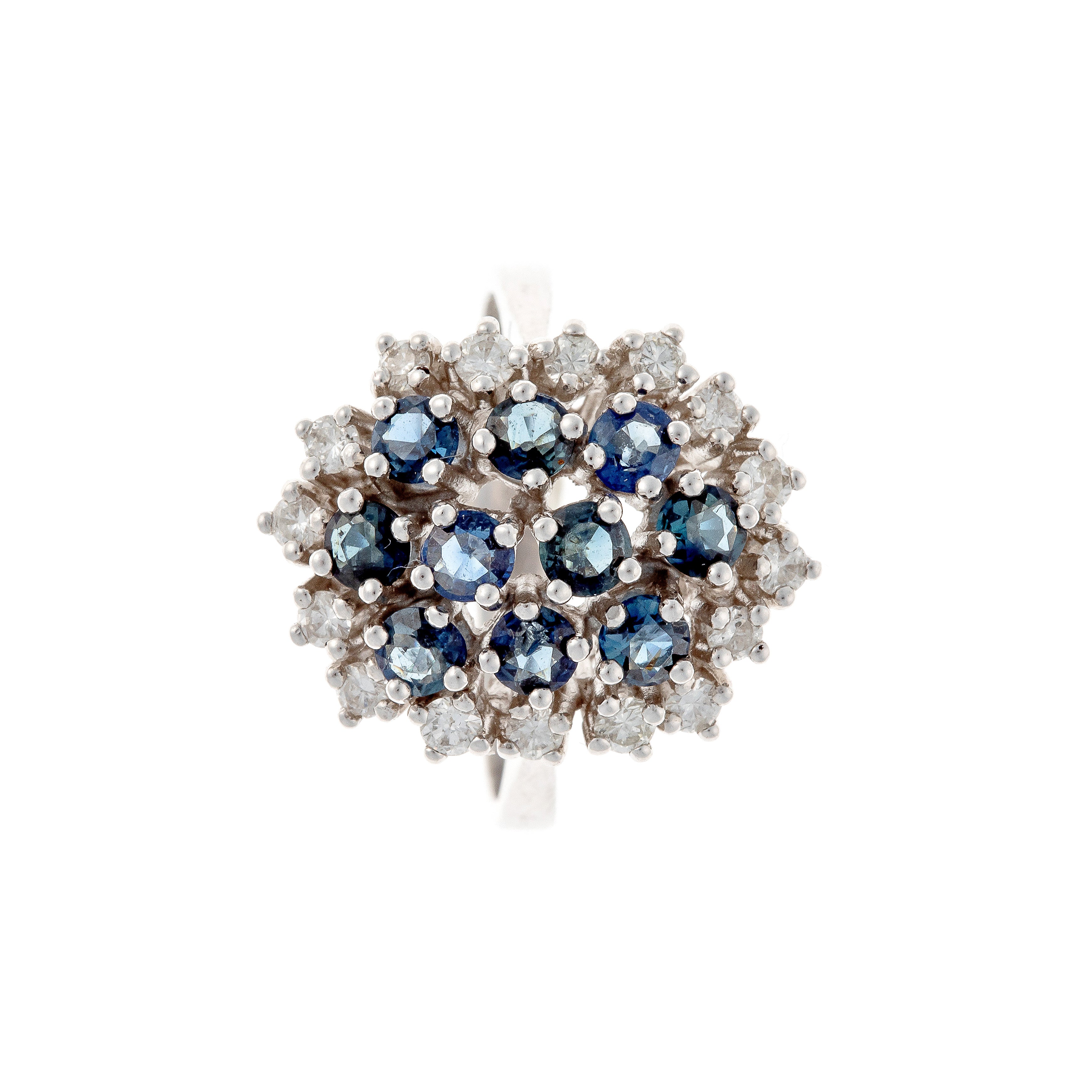 Top of the contemporary vintage white gold cluster cocktail ring with blue sapphires and diamonds.