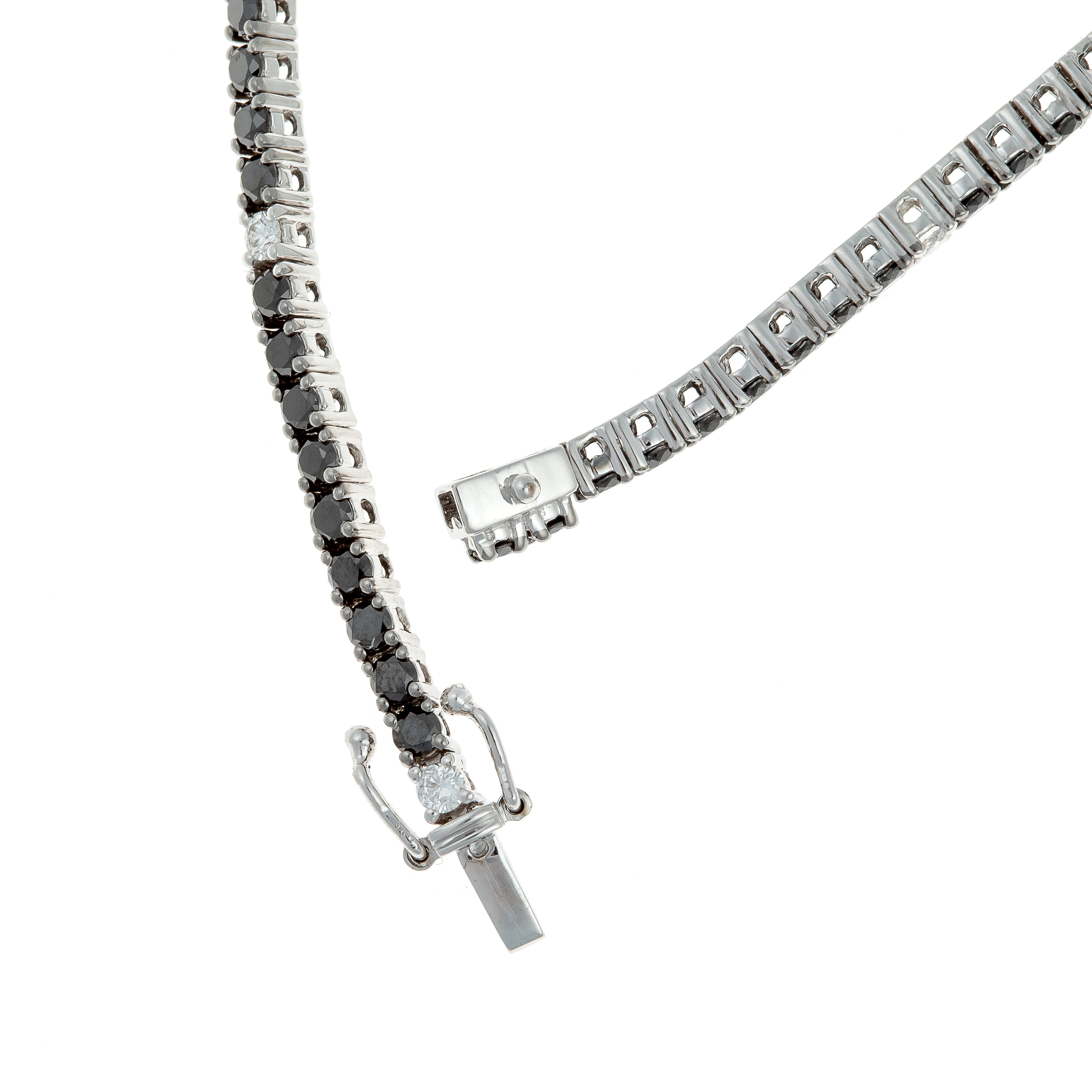 Close-up of the secure box clasp on a white gold black and white diamond tennis bracelet.