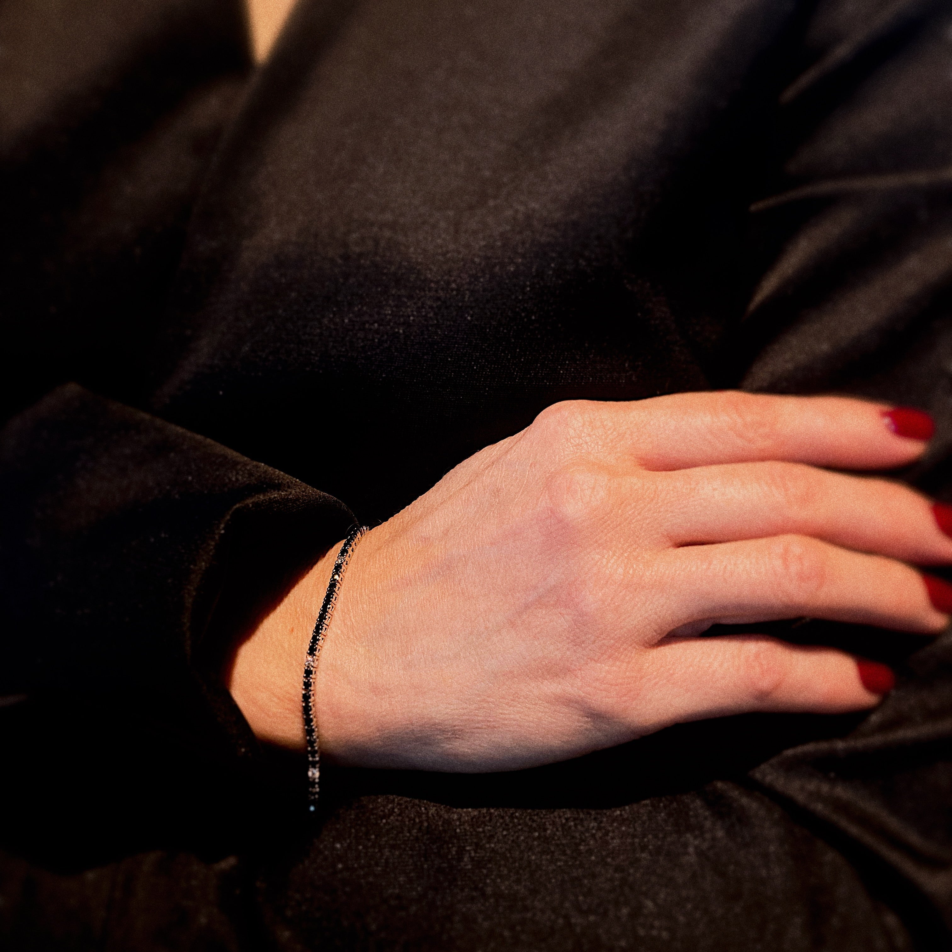 Model wearing the vintage white gold tennis bracelet with black diamonds.