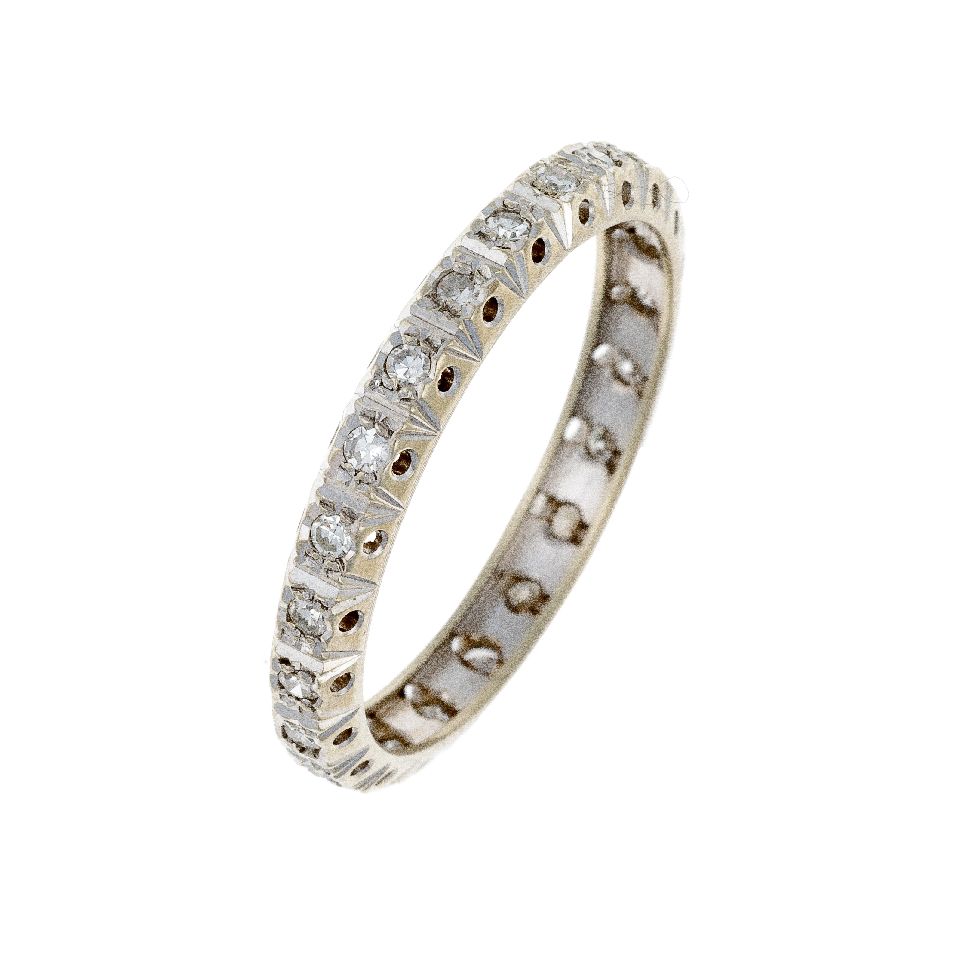 Angled view of white gold eternity band with brilliant-cut diamonds in full circle.